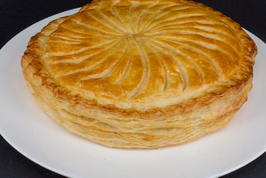 Large Galette de Rois served on a white plate