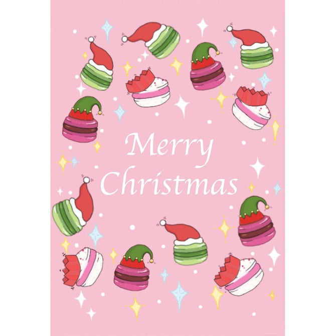 Soft pink A6 card with the words "Merry Christmas" on, surrounded with macaron wearing Christmas cracker and Santa hats.