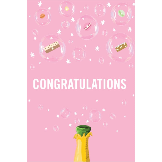 Soft pink A6 card with the word "CONGRATULATIONS" on. Featuring a bottle of fizz with macarons and brownies inside the bubbles.